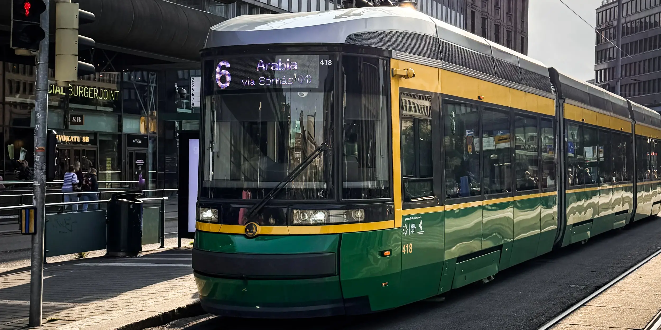 Helsinki Tram Green and yellow tram in Helsinki city centre, Finland