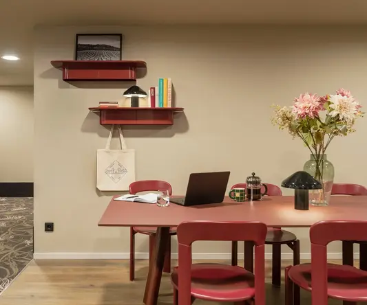 a room with a table and chairs