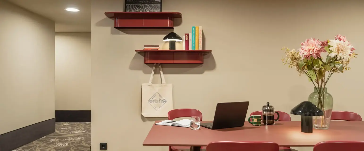 a room with a table and chairs