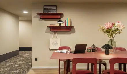 a room with a table and chairs
