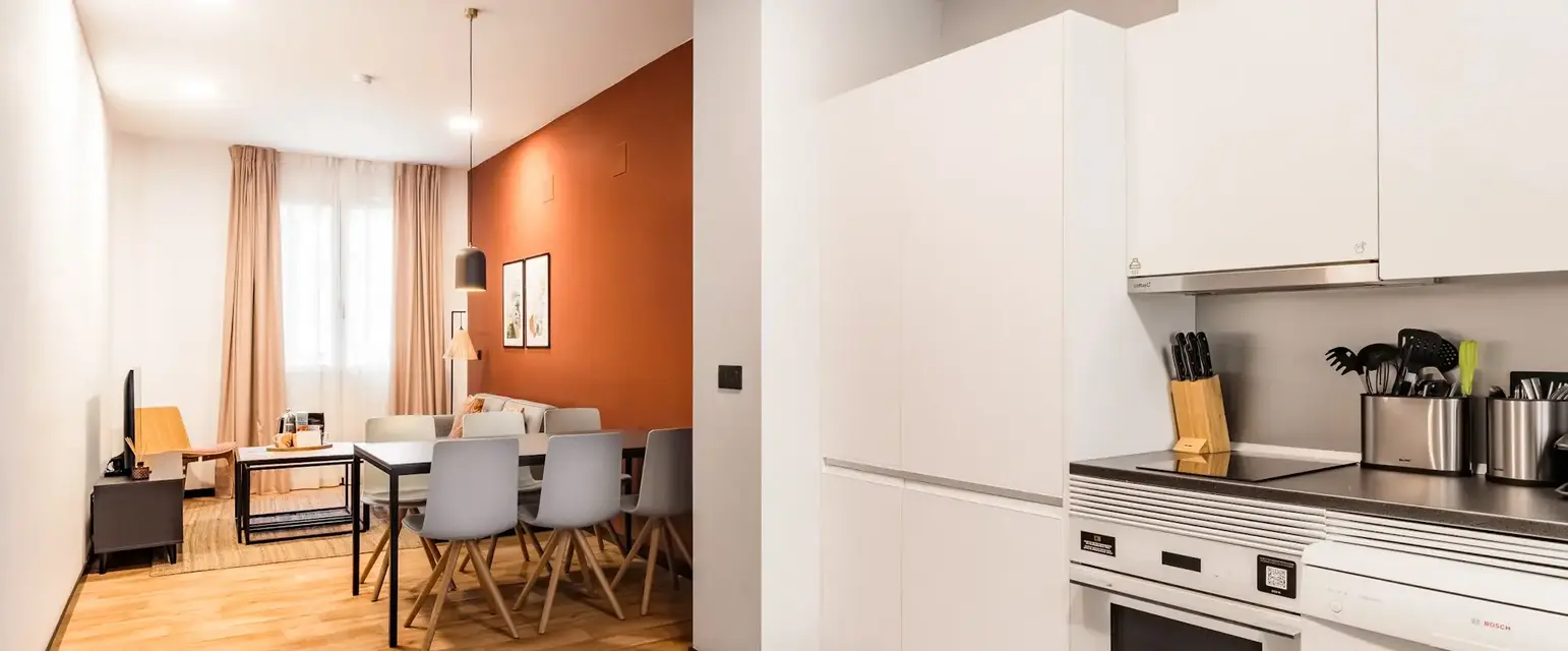 a kitchen with a dining table and chairs