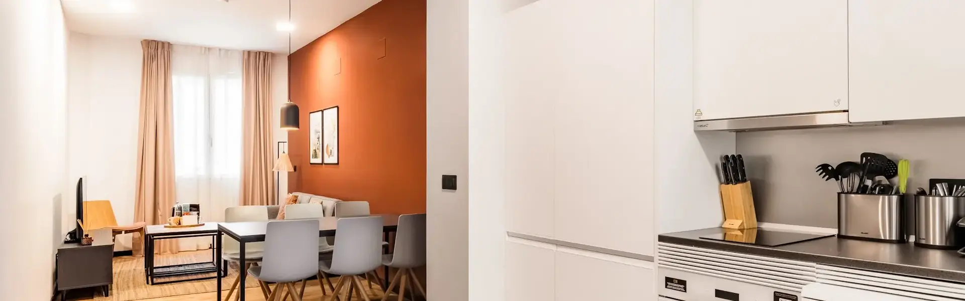 a kitchen with a dining table and chairs
