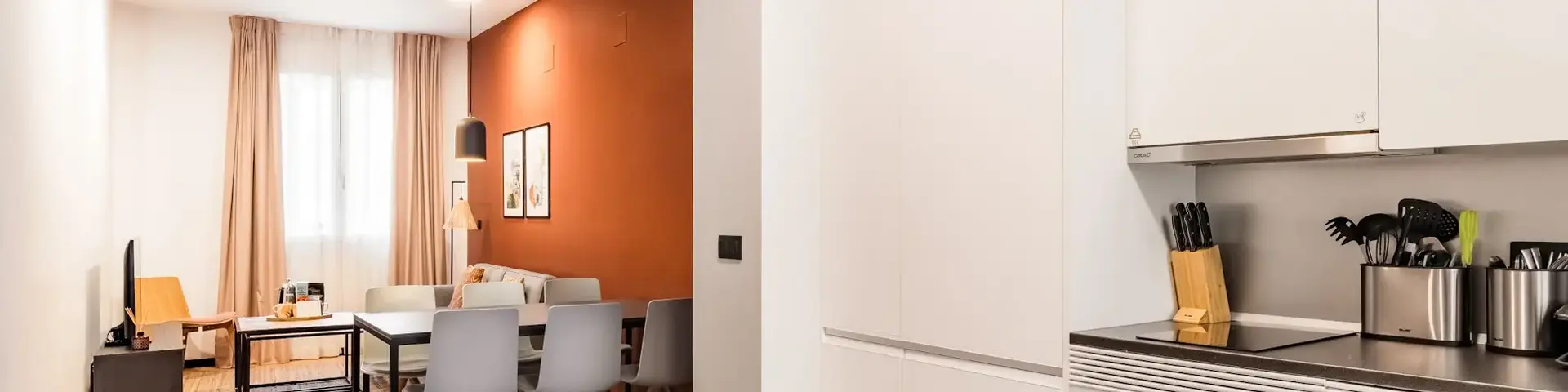 a kitchen with a dining table and chairs