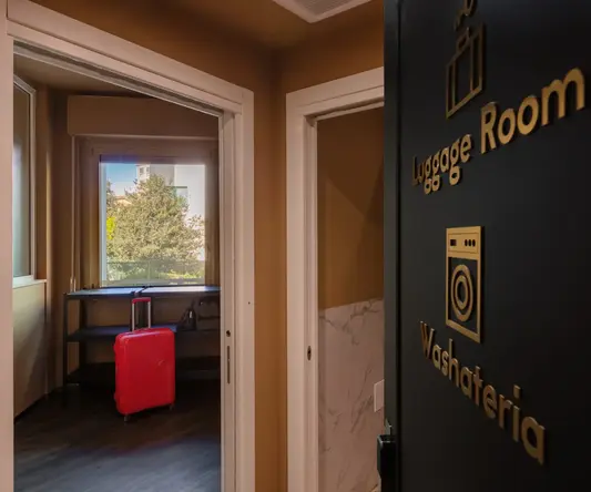 a door with a red suitcase in the background