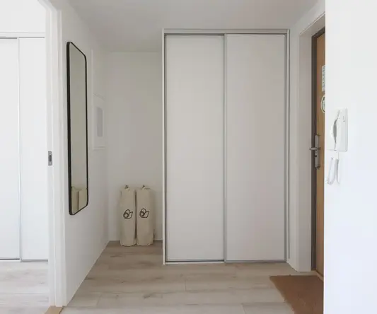 a white closet in a hallway