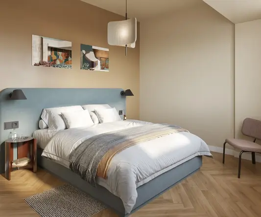 a bedroom with a bed and chair