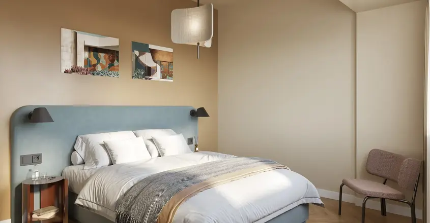 a bedroom with a bed and chair