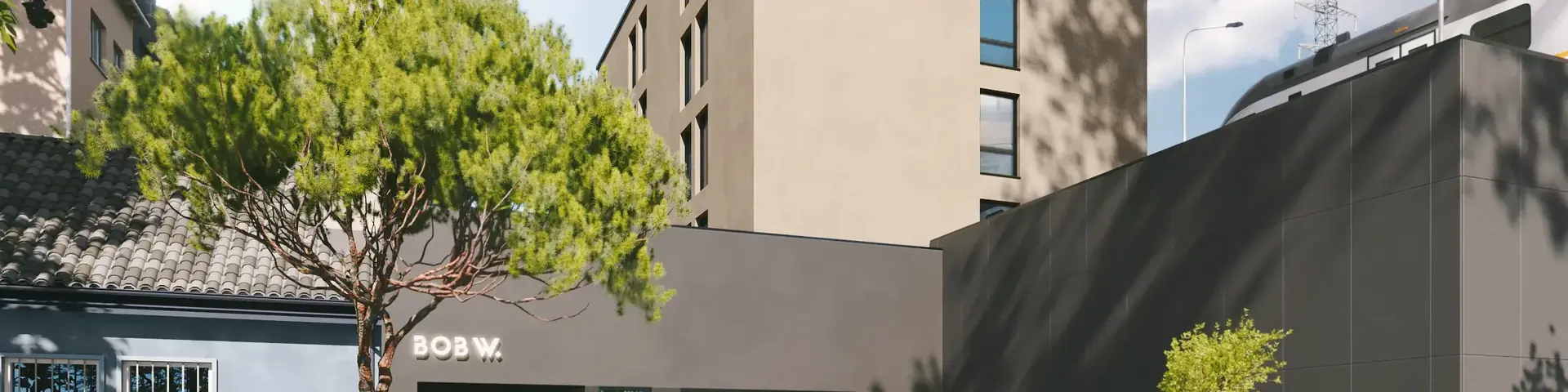 a building with trees and people in front of it