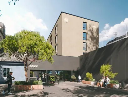 a building with trees and people in front of it