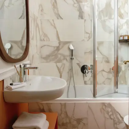 a bathroom with a shower and sink