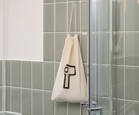 a bag on a shower door