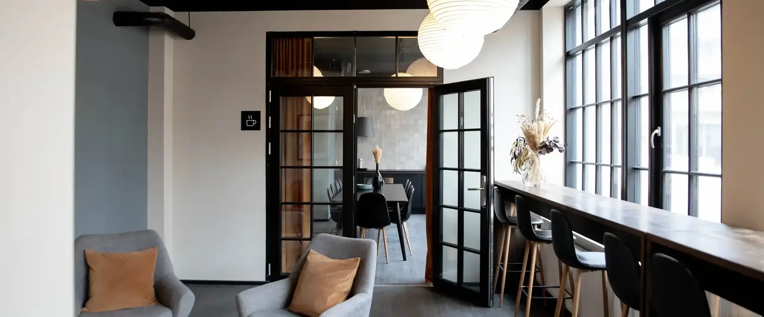 a room with a table and chairs