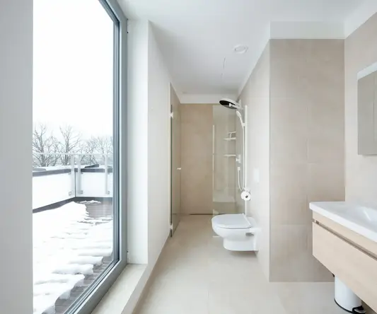 a bathroom with a large glass door