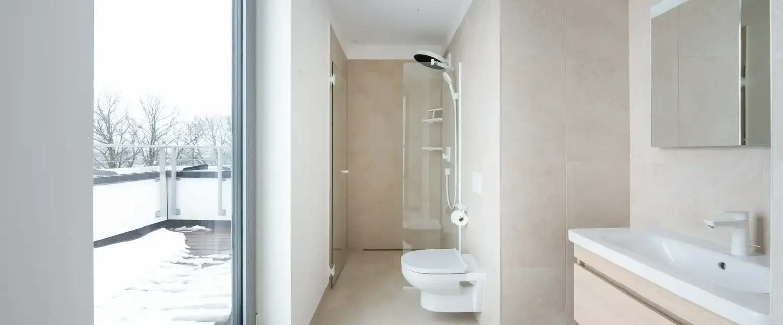 a bathroom with a large glass door