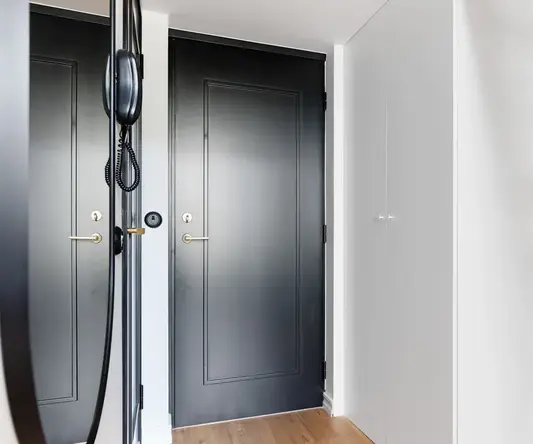 a black door in a hallway
