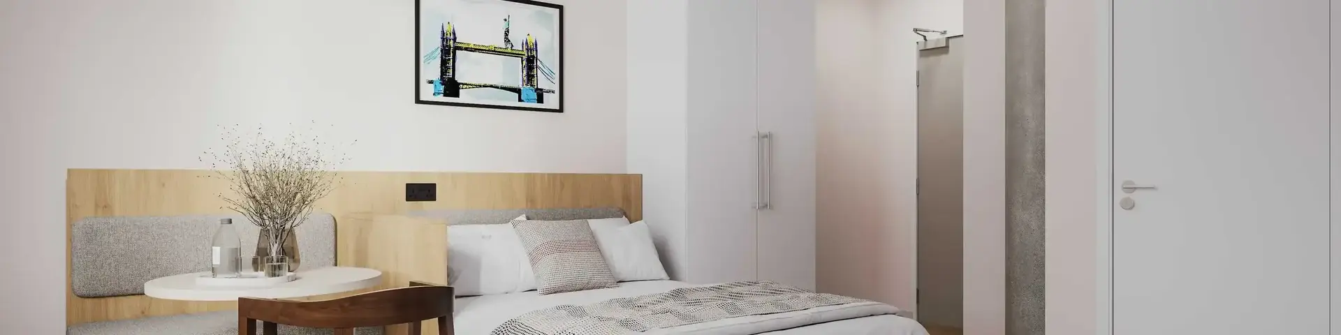 a bedroom with a bed and a table