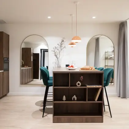 a dining room with a table and chairs