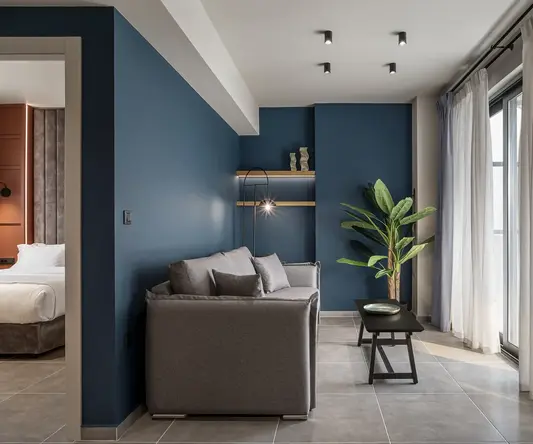 a living room with a couch and a plant