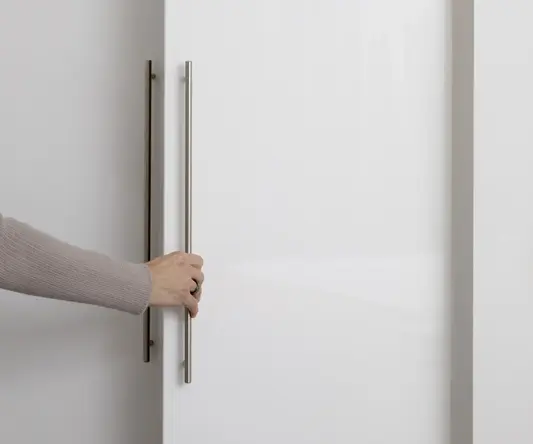 a person holding a white door