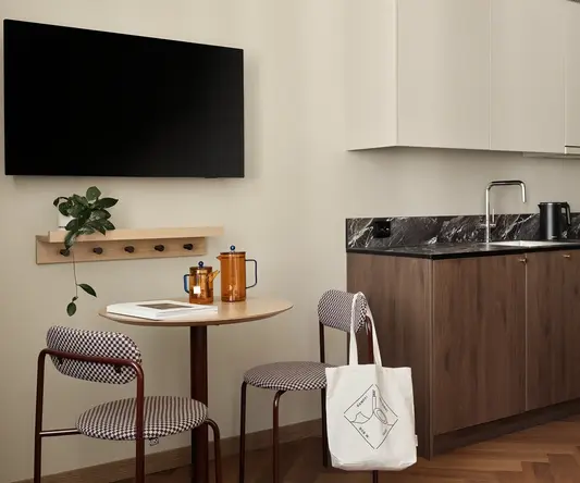 a kitchen with a table and chairs