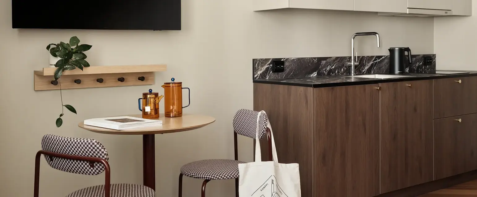 a kitchen with a table and chairs