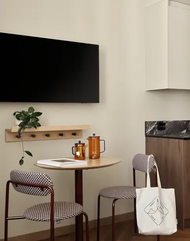 a kitchen with a table and chairs