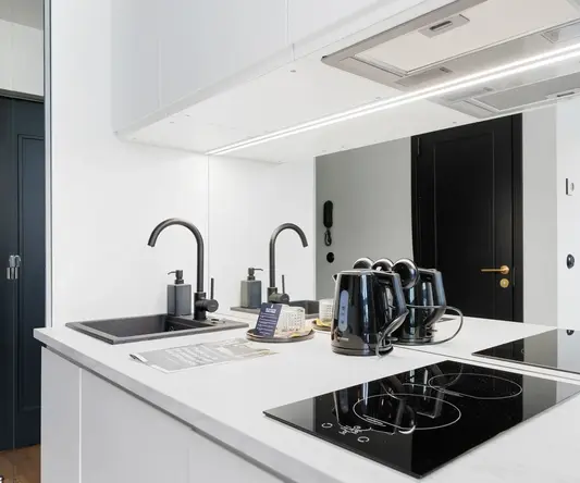 a kitchen with a stove and sink