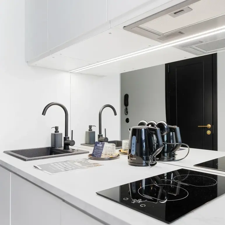 a kitchen with a stove and sink