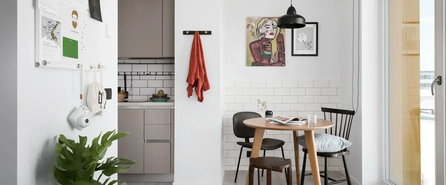 a dining room with a table and chairs