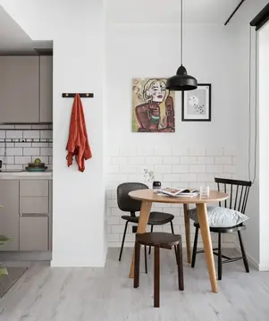 a dining room with a table and chairs