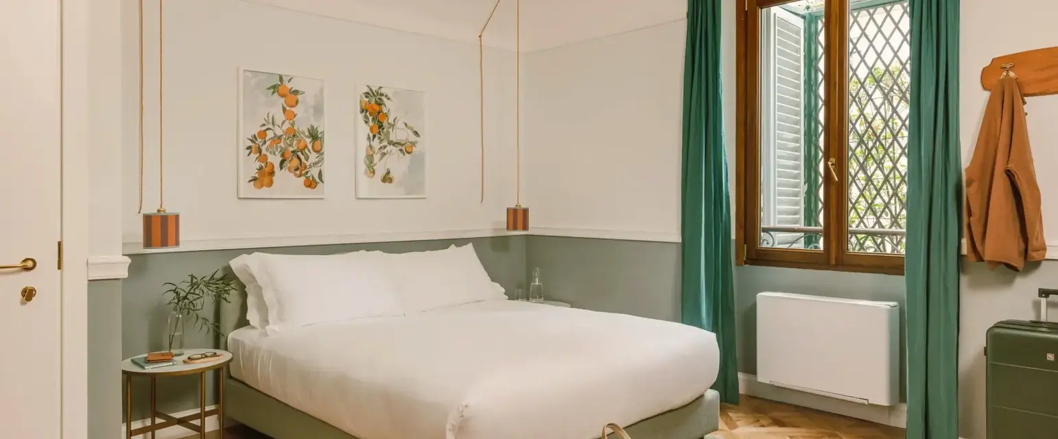 a bedroom with a bed and a bag