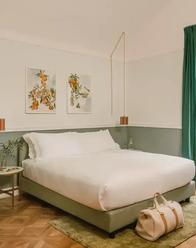 a bedroom with a bed and a bag