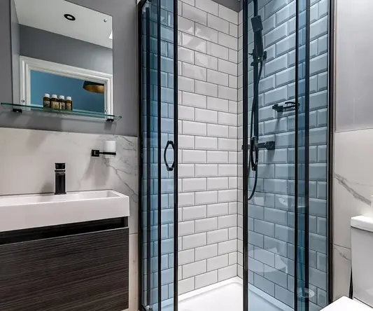 a bathroom with a shower and sink