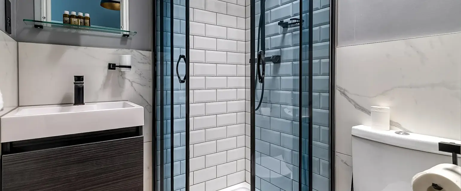 a bathroom with a shower and sink