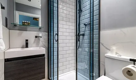 a bathroom with a shower and sink