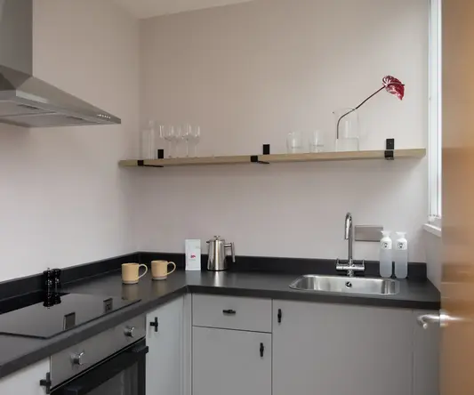 a kitchen with a sink and a stove