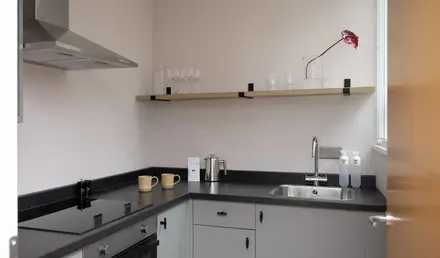 a kitchen with a sink and a stove