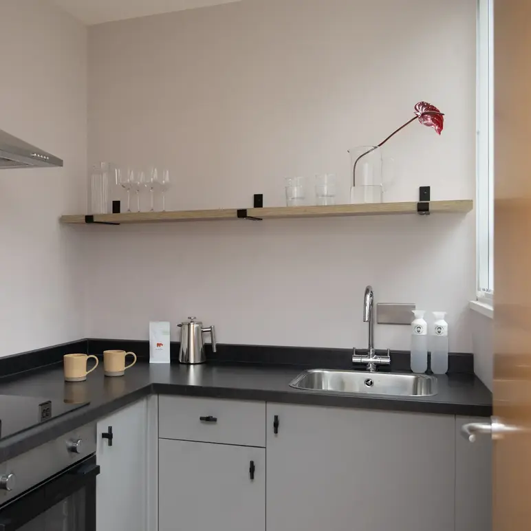 a kitchen with a sink and a stove