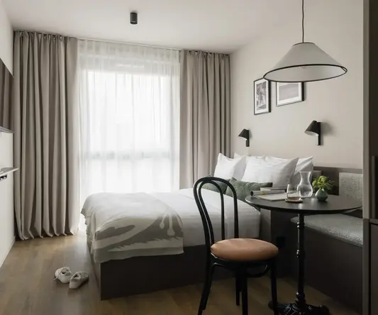 a room with a bed and a table