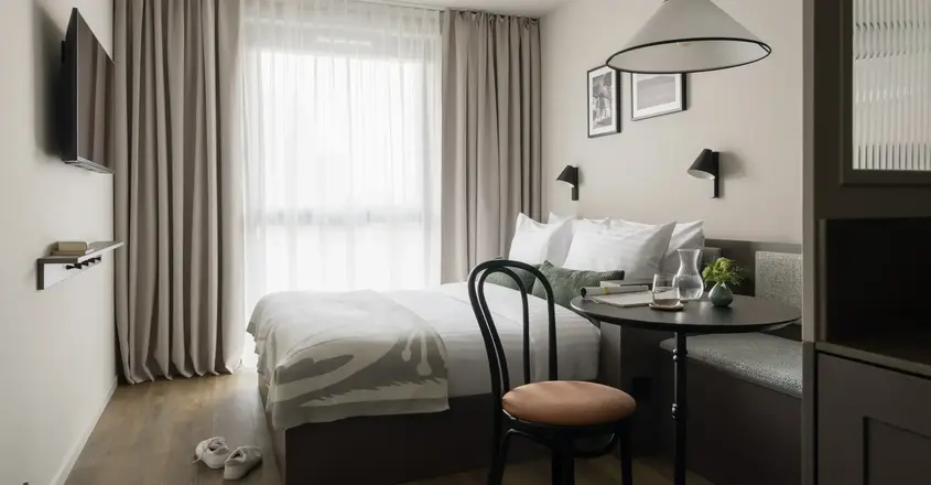 a room with a bed and a table
