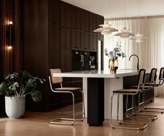 a kitchen with a table and chairs