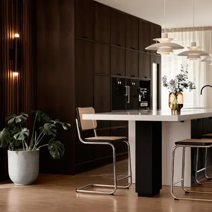 a kitchen with a table and chairs