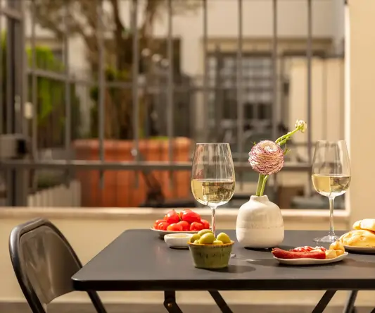 a table with food and wine glasses on it