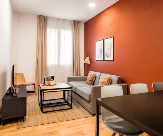 a living room with a couch and table