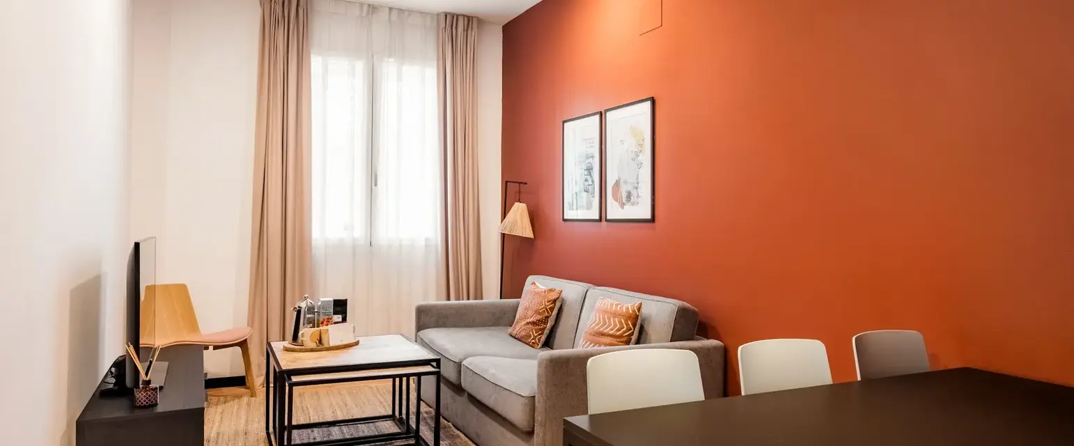 a living room with a couch and table