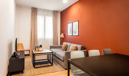 a living room with a couch and table