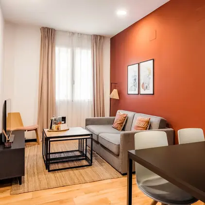 a living room with a couch and table