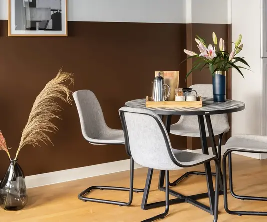 a table with chairs in a room
