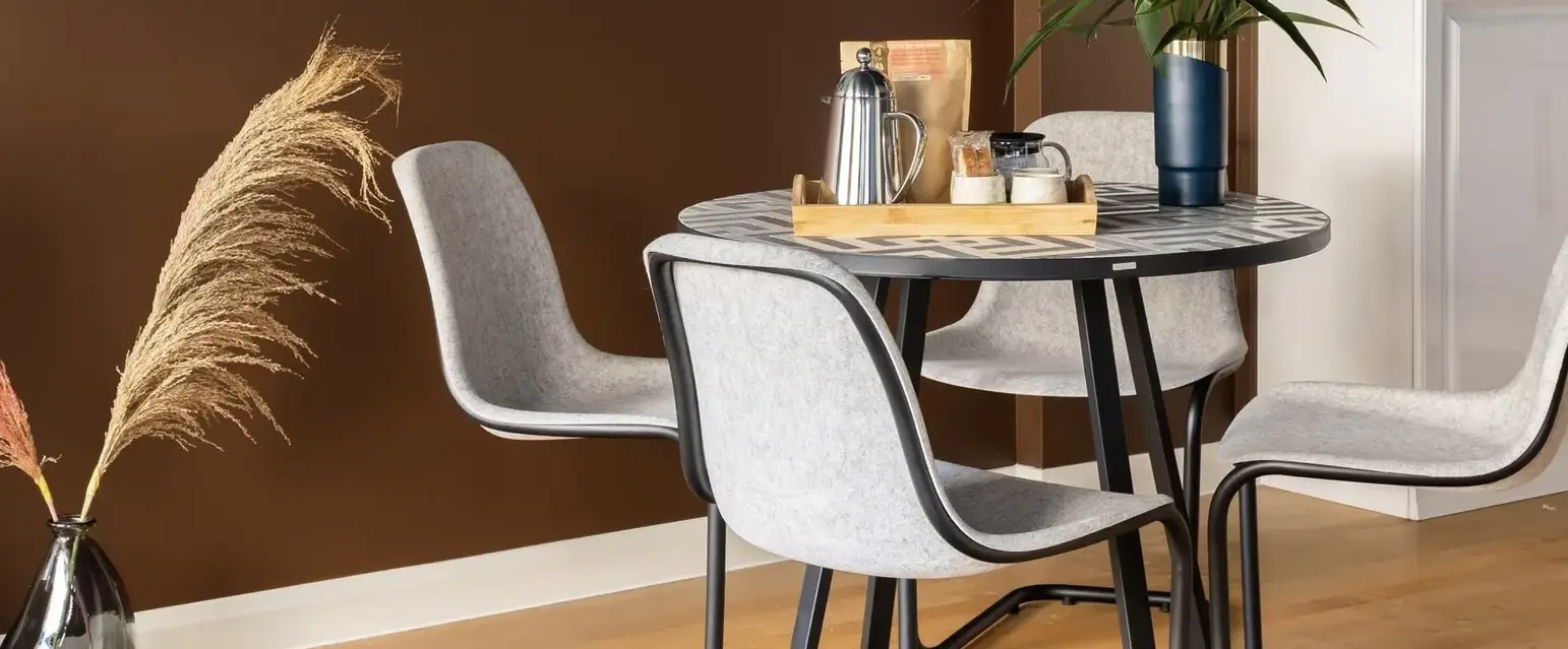 a table with chairs in a room