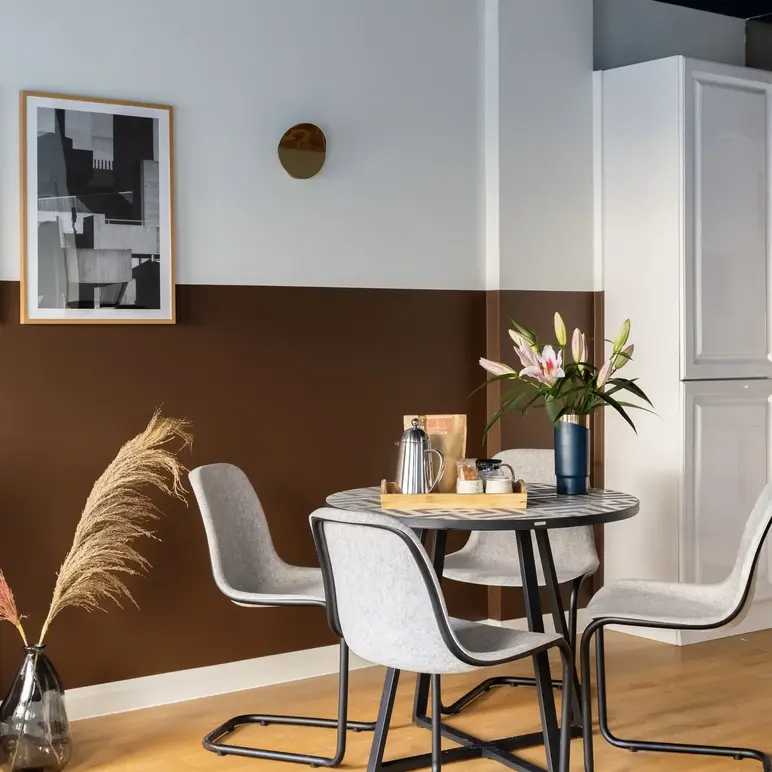 a table with chairs in a room